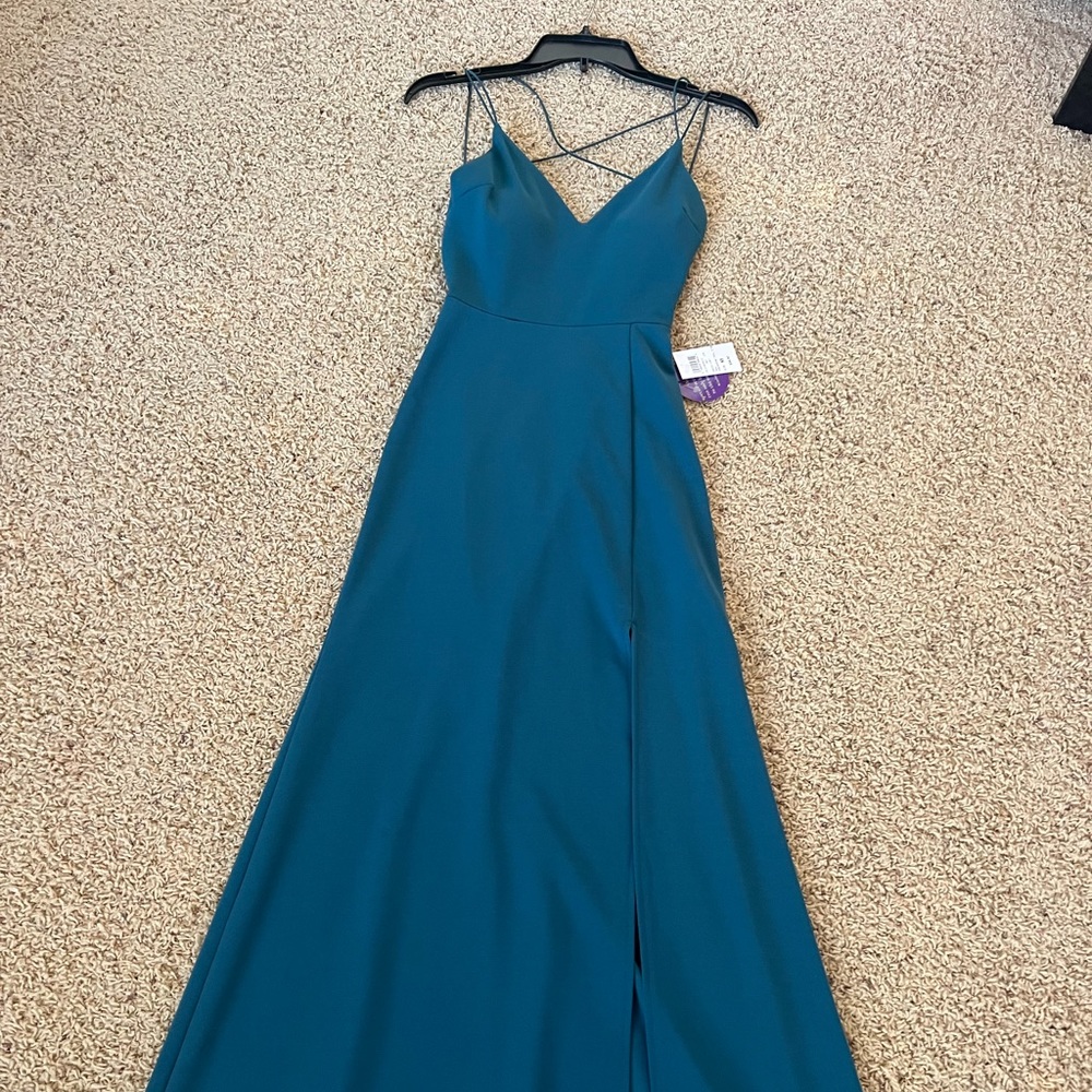 NWT long teal dress with slit!
Perfect for prom or college formal! l